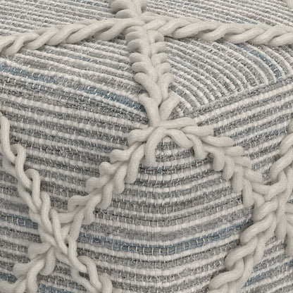 Close-up of the Cowan Handcrafted Square Pouf featuring thick, cream yarn braided over a textured, striped fabric in gray, white, and light blue tones.