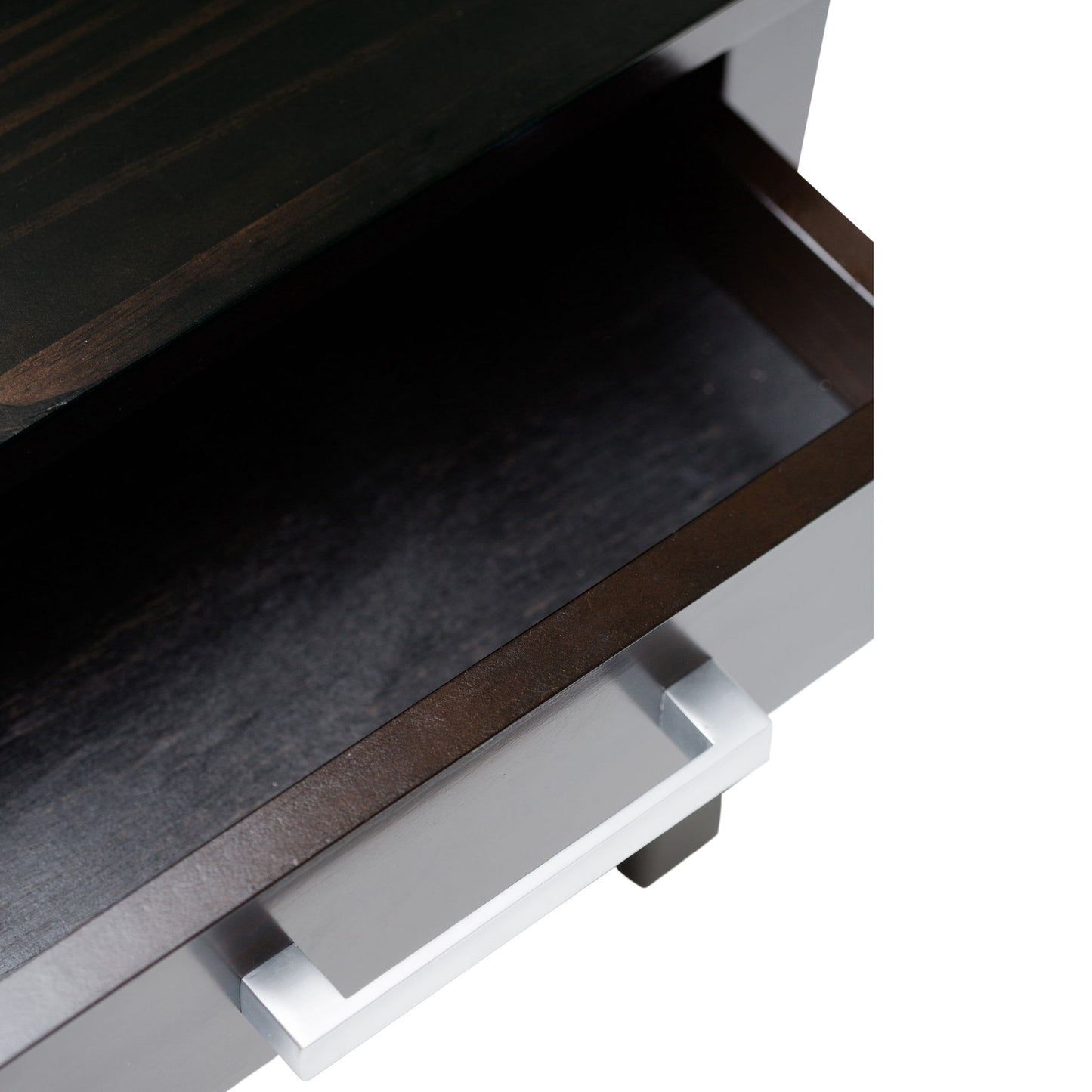 A close-up of an empty, partially open drawer with a metallic handle on the dark wood Kitchener - Handcrafted Table.