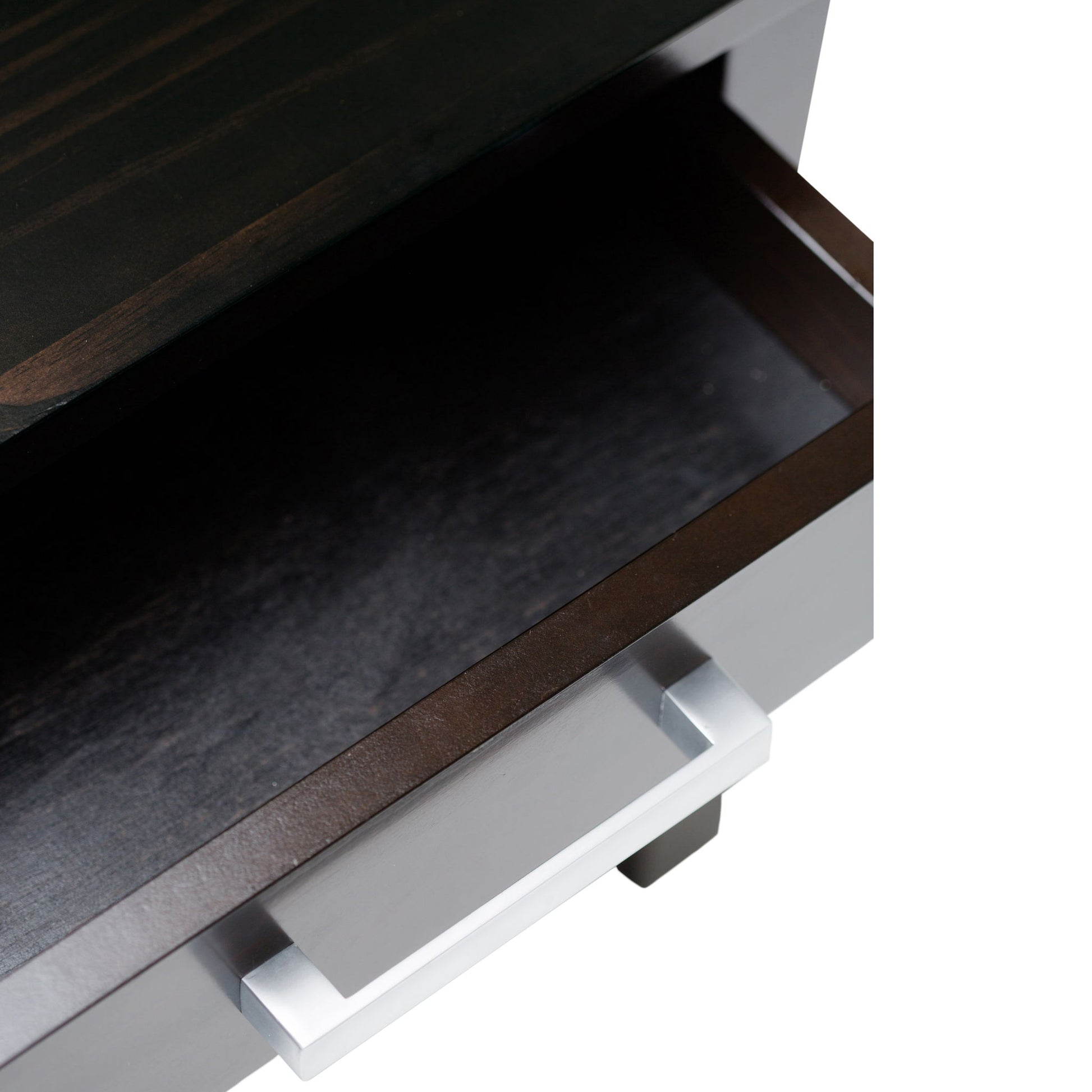 A close-up of an empty, partially open drawer with a metallic handle on the dark wood Kitchener - Handcrafted Table.