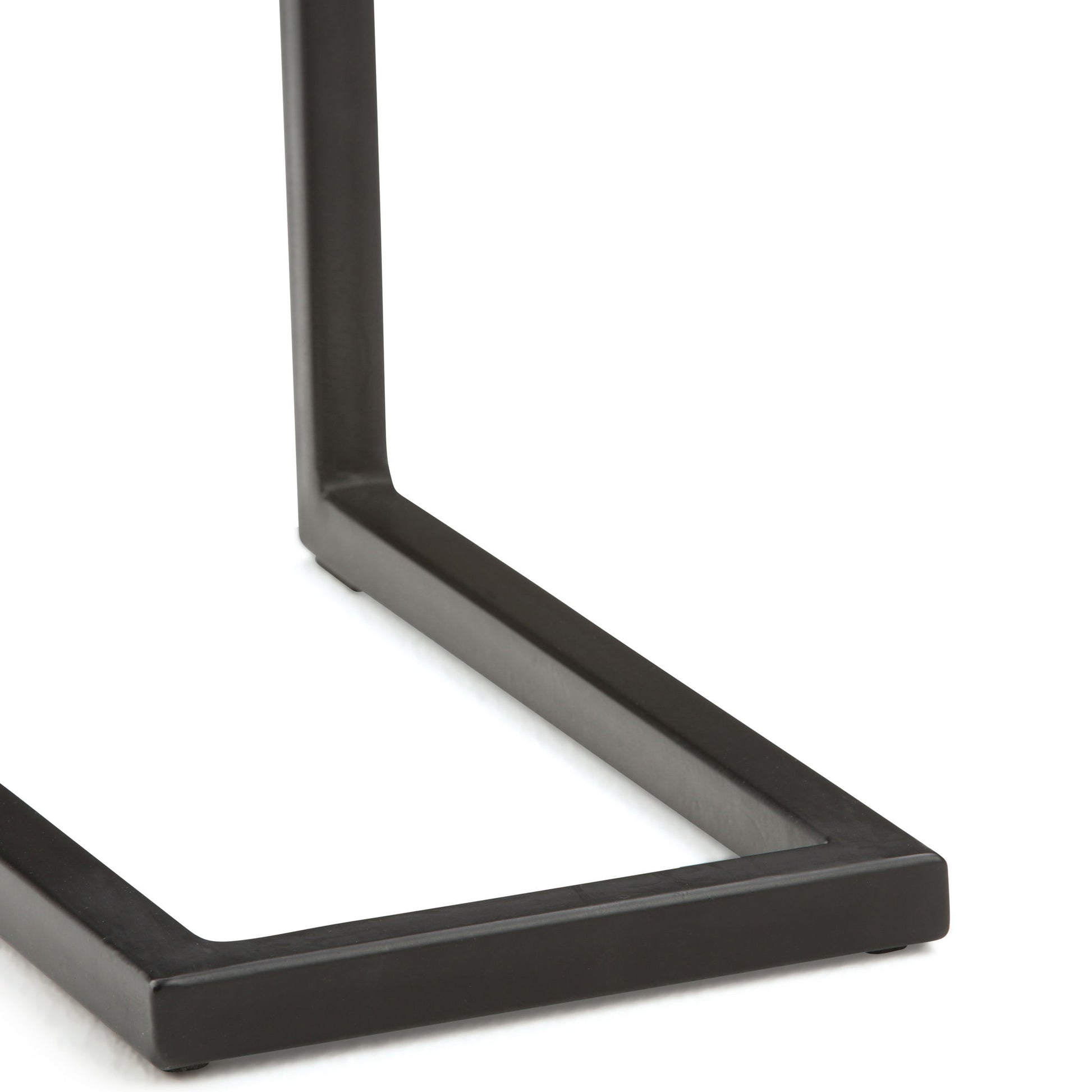 Close-up view of the black metal base of the Skyler - Handcrafted C Side Table, featuring a square-shaped leg and a clean, minimalist design.