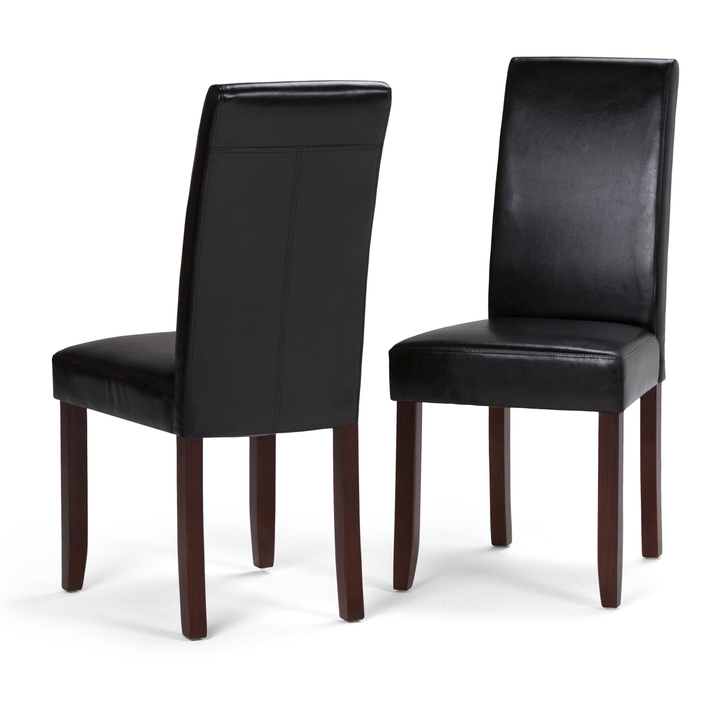 The Acadian Upholstered Parson Dining Chair set of 2 features black faux leather seats and dark wooden legs, shown with one chair facing forward and the other turned backward against a white background.