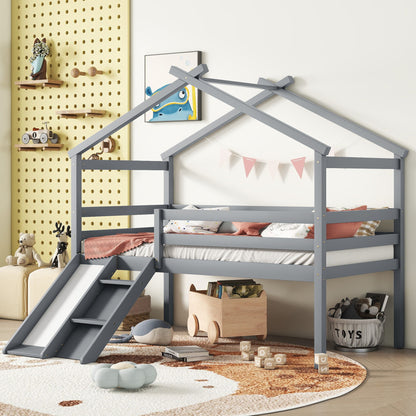 Children’s bedroom featuring a Low Loft House Bed With Slide, Ladder, Safety Guardrails, and House Roof Frame in gray, complemented by pastel bedding, wall decor, stuffed toys, a round rug, and a toy storage basket for a playful vibe.