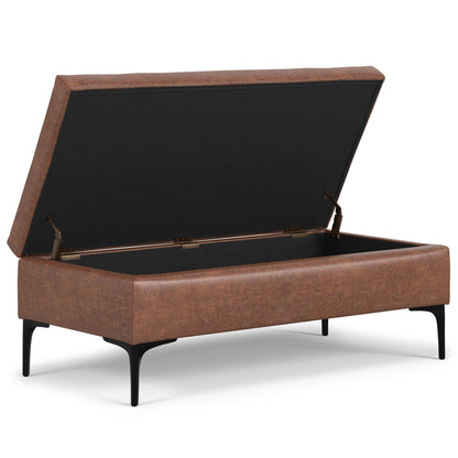 The Rebecca Multifunctional Coffee Table Storage Ottoman features a brown upholstered exterior, black metal legs, and a lift-up lid that reveals a spacious storage compartment inside.