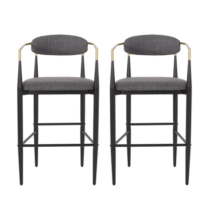 A set of two Counter Height Upholstered Barstools features black metal frames, gold-accented armrests, and dark gray upholstered seats and backrests, shown side by side against a white background.