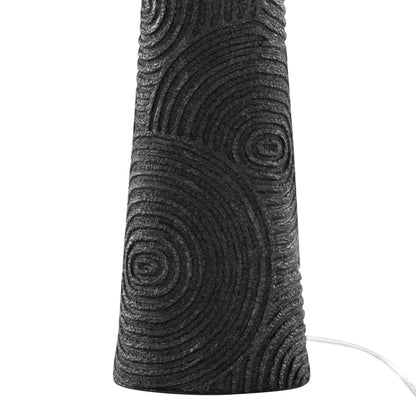 Close-up of the Kona - Contemporary Table Lamp (Set of 2) in Matte Black, showing its textured base with concentric circles and a white power cord extending from the right.