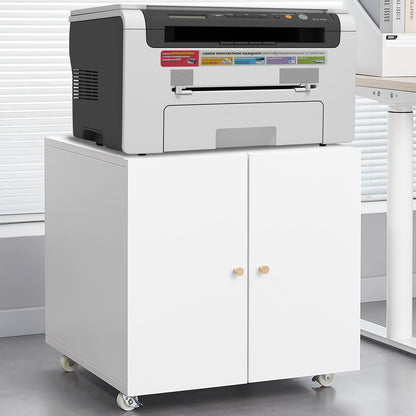 The Office Furniture Copier Cabinet 2 Door Steel Copier Stand Mobile Pedestal File Printer Stand holds a gray printer and features two doors with wooden knobs, wheels for mobility, and fits well in an office with blinds and a gray floor.