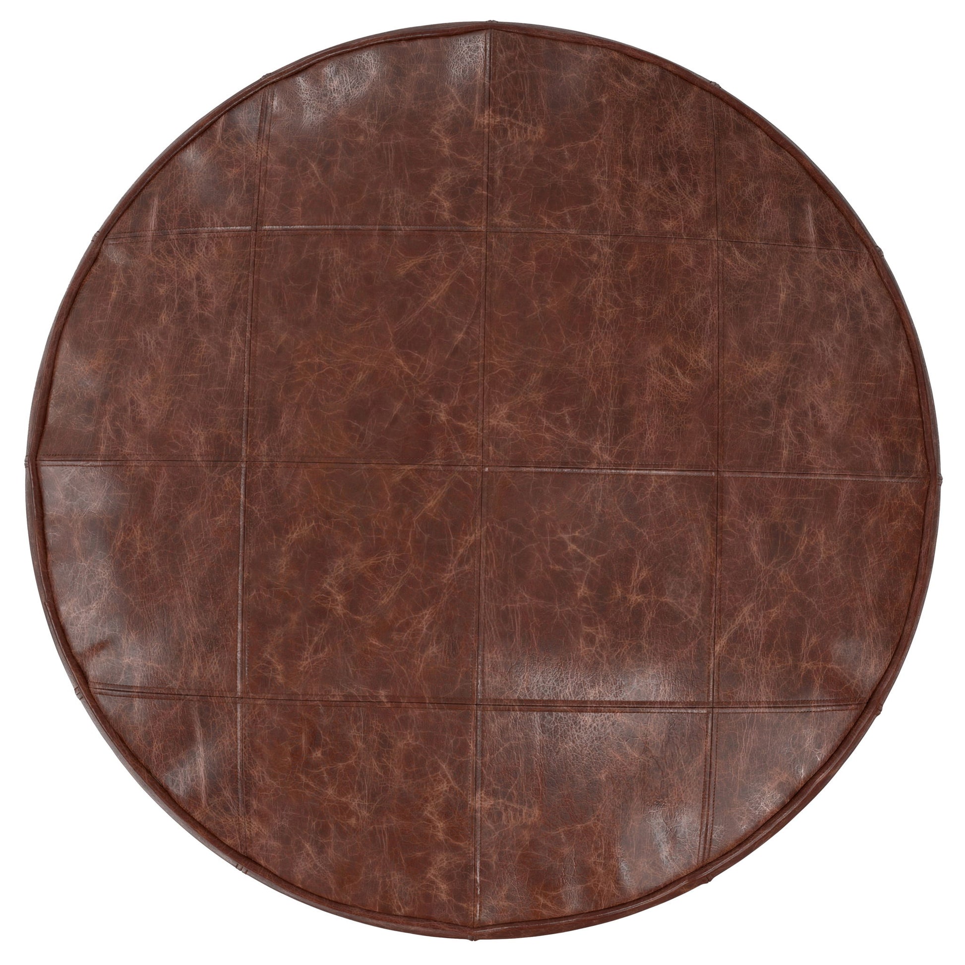 The Connor - Handcrafted Round Pouf features a brown leather surface with visible stitched seams forming a grid pattern and a slightly distressed, textured finish.