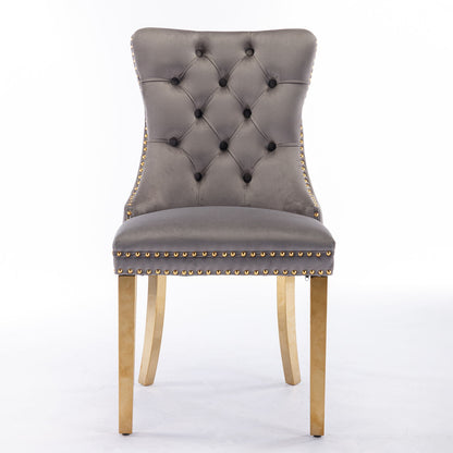 The Nikki set includes two modern, high-end tufted velvet dining chairs with nailhead trim and golden stainless steel-plated legs, shown against a plain white background.