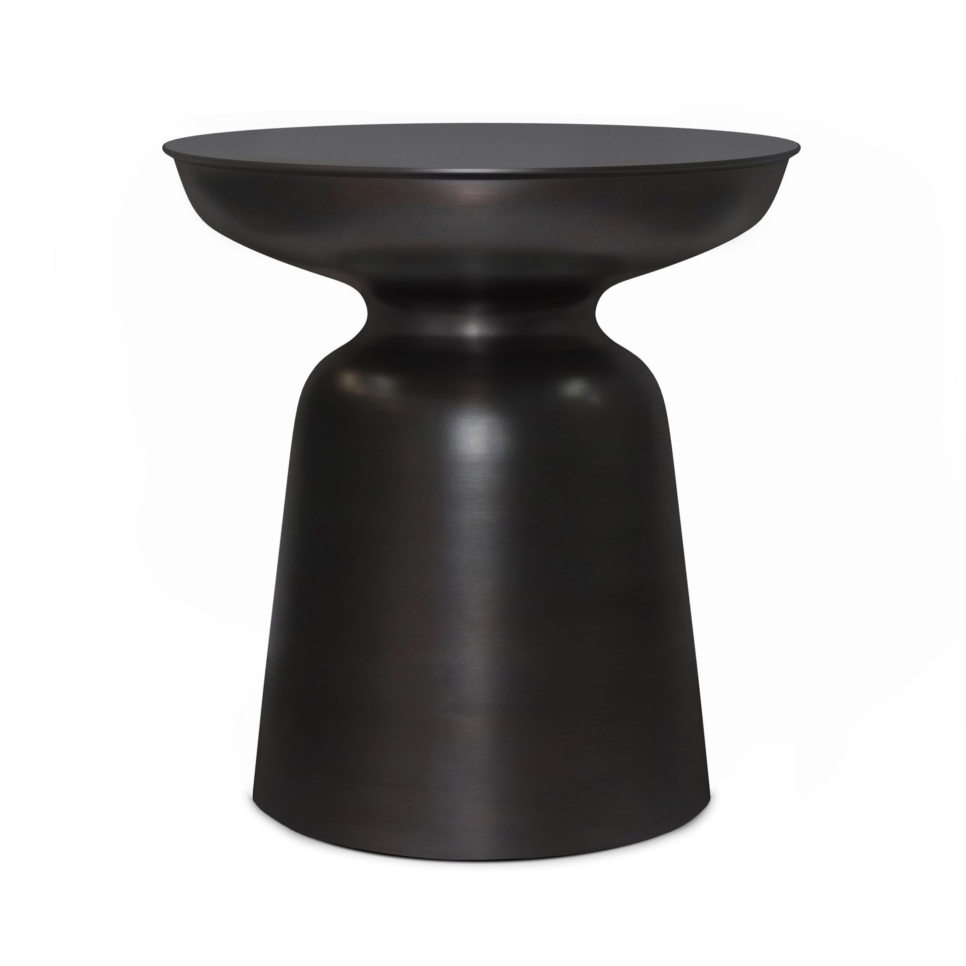 The Toby Handcrafted Metal Accent Table features a modern black metal design with a round top, narrow waist, and wider base, creating a sleek hourglass silhouette.