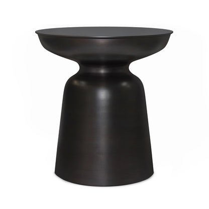 The Toby Handcrafted Metal Accent Table features a modern black metal design with a round top, narrow waist, and wider base, creating a sleek hourglass silhouette.