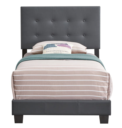 The Caldwell - Bed features a twin size with a tall dark gray tufted headboard, beige and white striped bedding, a green throw blanket, and a decorative pillow with colorful clouds and text.