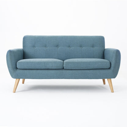 The Modern Loveseat Sofa With Button Tufted Backrest features a stylish blue finish, wooden legs, and gently curved armrests, shown against a plain white background.