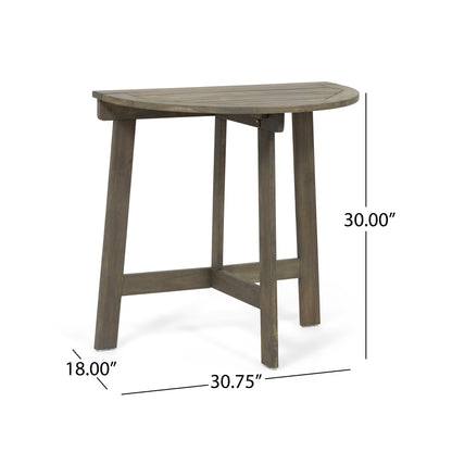 The Outdoor Half Round Folding Acacia Wood Bistro Table features a small, semi-circular design with three legs and support bars. Dimensions: 30" high, 18" deep, and 30.75" wide.