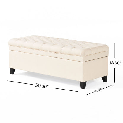 The Juliana Storage Ottoman features beige upholstery, a tufted top, birch legs, and measures 50" W x 20.5" D x 18.3" H.