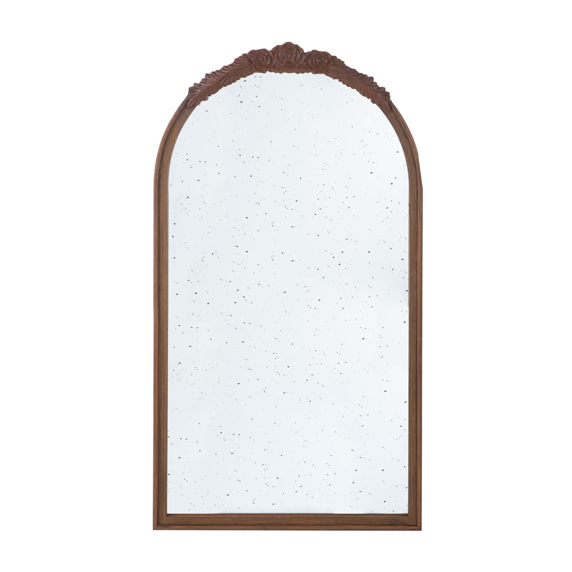The Hand Carved Rose Antique Mirror features a tall wooden arch frame with ornate floral carving and a slightly speckled antiqued glass, perfect for living room wall decor.