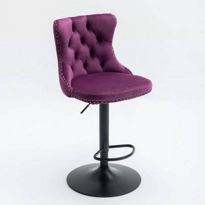 A set of 2 modern purple swivel velvet barstools with comfortable tufted backs, nailhead trim, and adjustable black metal pedestal bases with circular footrests. Ideal for home pub or kitchen island. Plain white background.