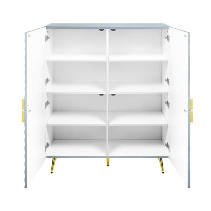The Gaines High Gloss Accent Cabinet features gold handles and legs, a light blue top with scalloped edges, and two open white doors revealing four shelves inside.