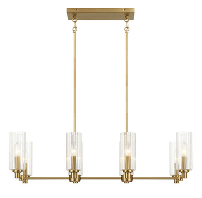 A gold, rectangular chandelier named "Willow" features eight upward-facing clear ribbed glass-shaded lights in an antique brass finish, hanging from two parallel rods attached to a ceiling mount against a plain white background.