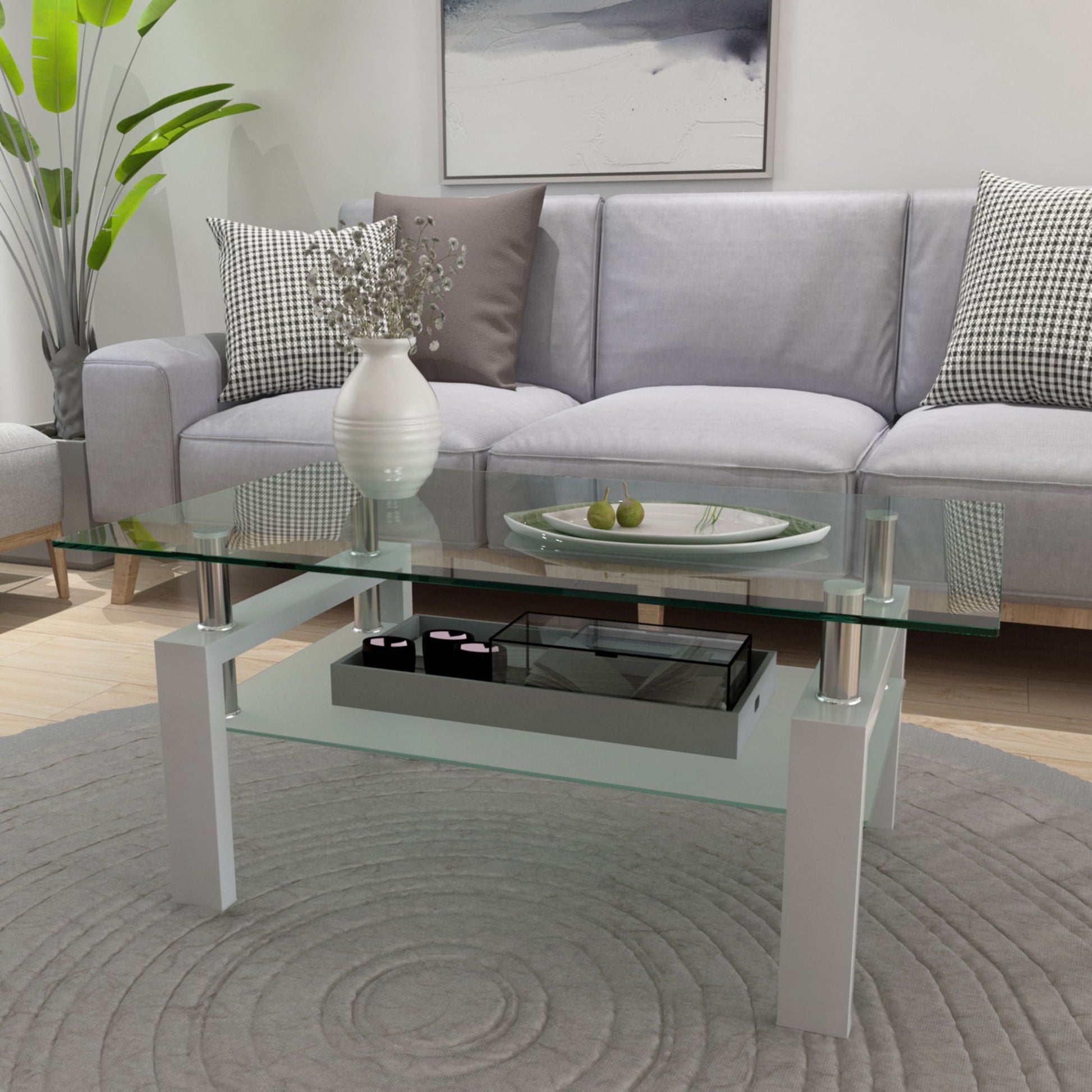 A modern living room with a Rectangle Coffee Table, Modern Side Center Tables For Furniture, holding a white vase with flowers and a decorative plate, placed before a light gray sofa with plaid pillows on a round patterned gray rug.