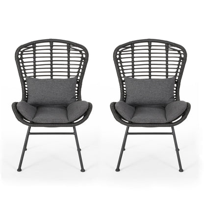 The Calypso Outdoor Chairs feature black rattan-style design, high backs, iron frames, and water-resistant dark gray seat and lumbar cushions; shown side by side on a white background.