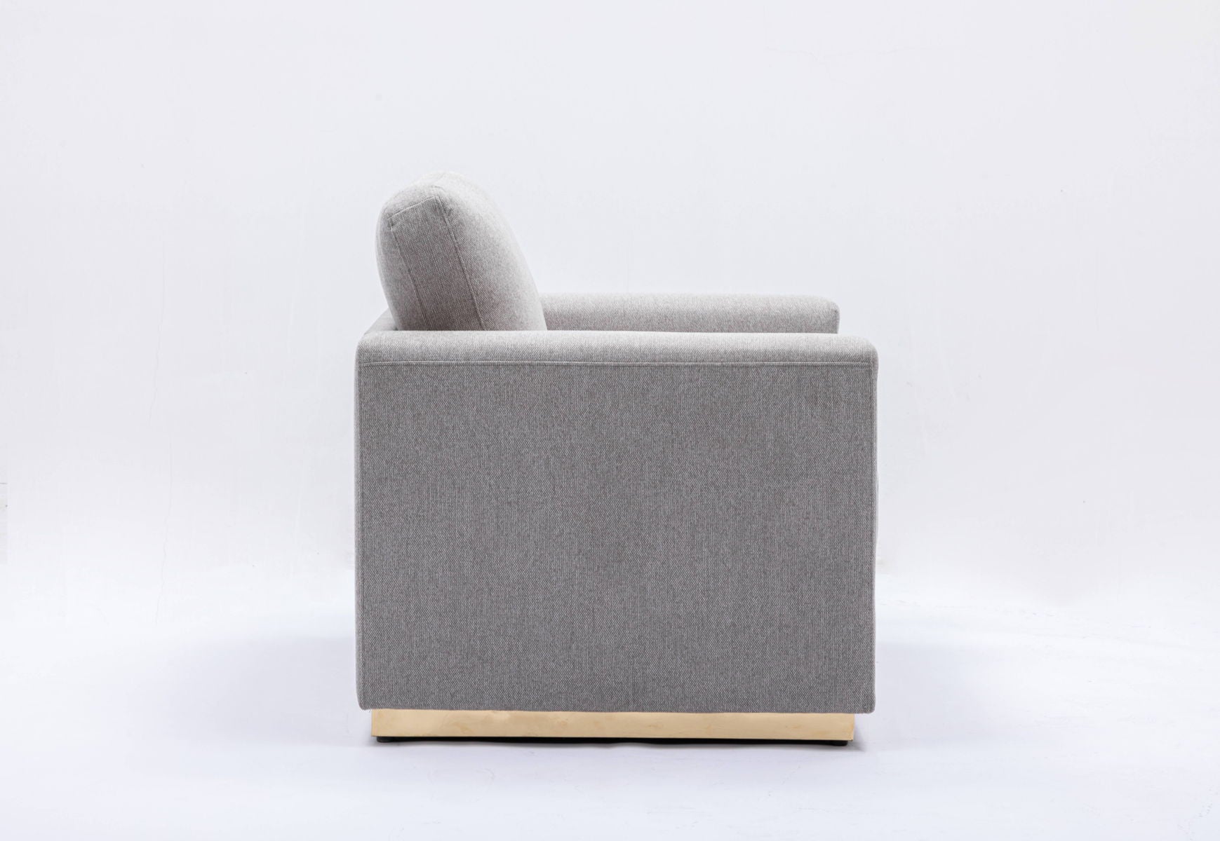 The Couch.com Valin Linen Chair for Living Room features a modern style with light gray fabric, clean lines, and a square shape on a low gold base, shown in side view against a plain white background.