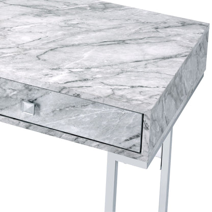 A close-up of the Tigress Printed Faux Marble Top Writing Desk in white, featuring a gray marble-patterned surface, a single front drawer with a square silver knob, and sleek metal legs.