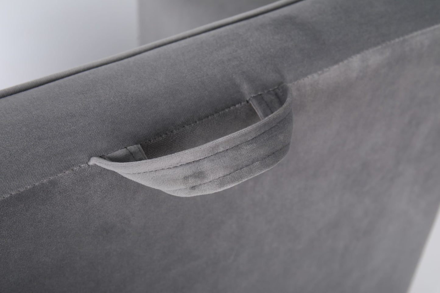 A close-up of the gray upholstery and fabric handle on the Durable Design Kids Club Sofa, highlighting its sturdy construction and kid-friendly design.