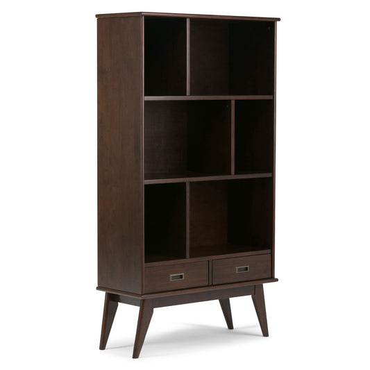The Draper - Mid Century Wide Bookcase and Storage Unit features a tall, dark brown wooden design with four open shelves, two bottom drawers, angled legs, and classic mid-century modern style.