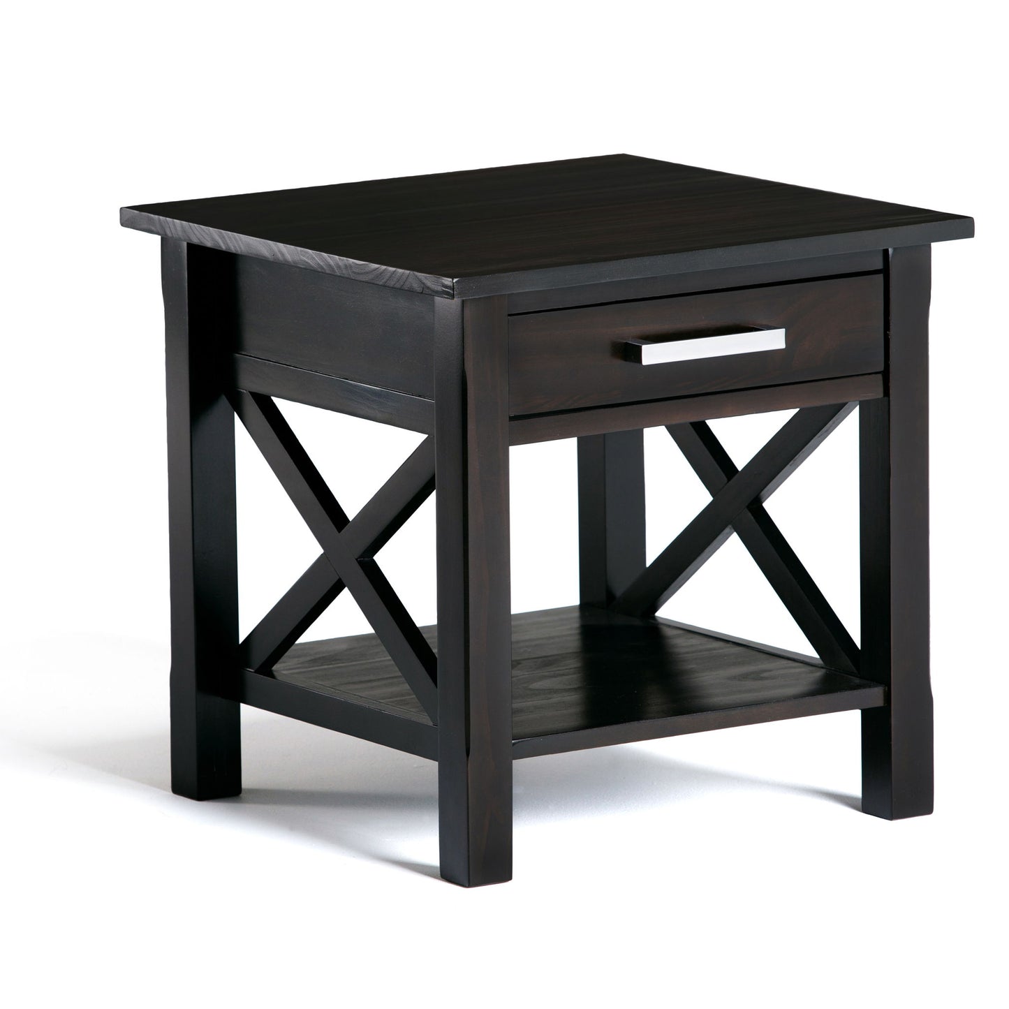 The Kitchener - Handcrafted Table is a dark wood end table featuring a single drawer with a silver handle, a lower shelf, and X-shaped side supports, shown against a white background.