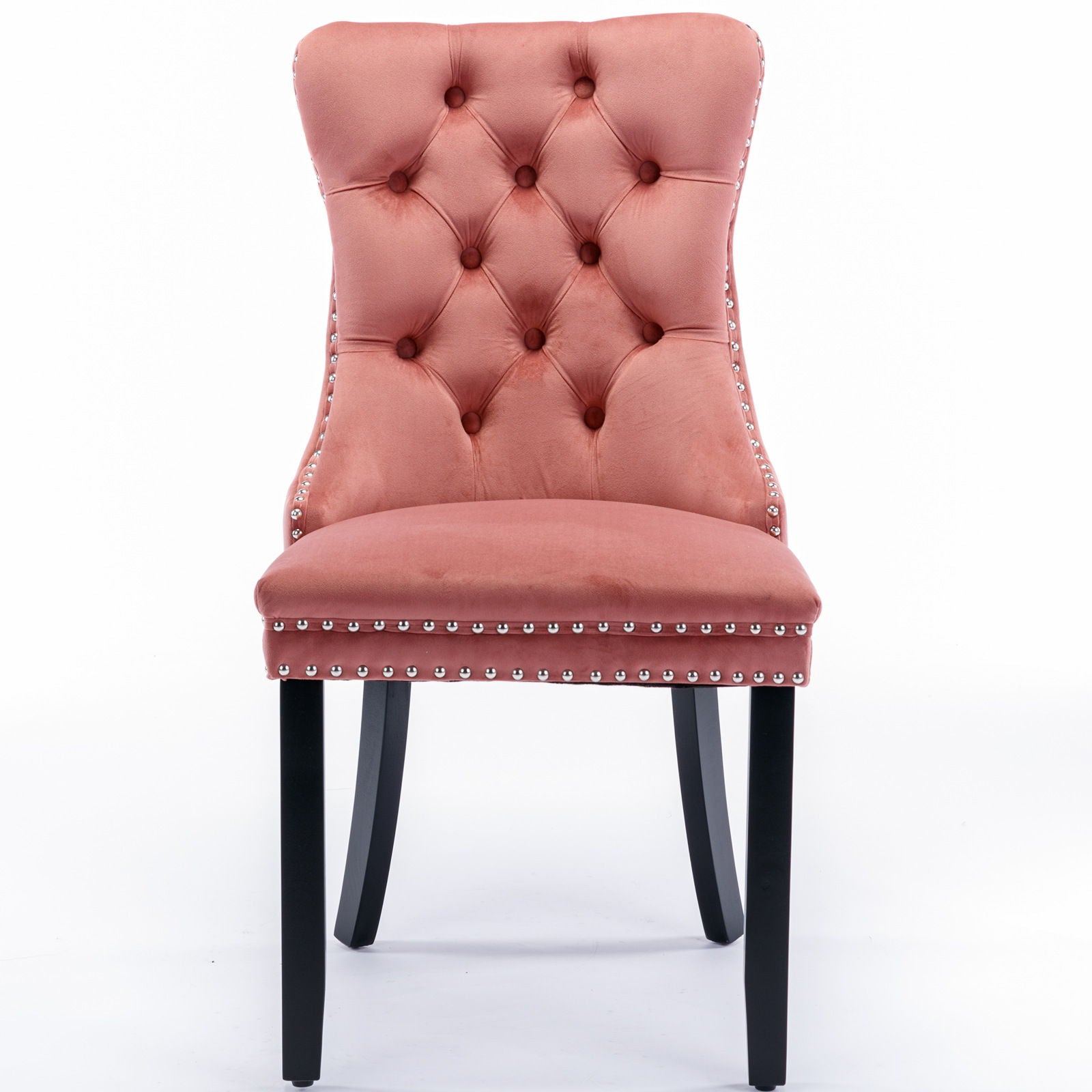 The Nikki set features two modern, high-end pink velvet tufted dining chairs with solid black wood legs and silver nailhead trim, shown against a white background.