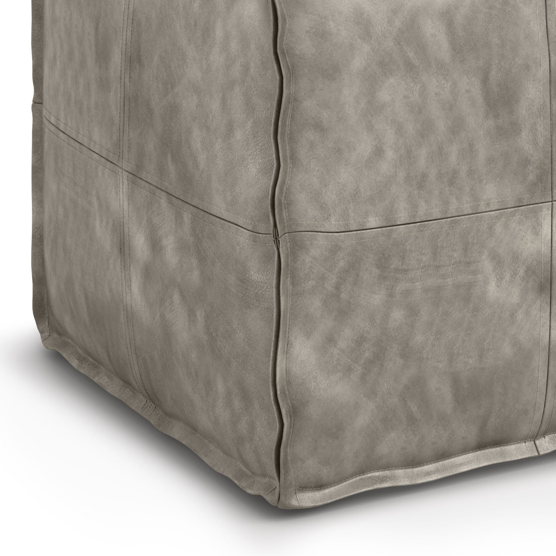 Close-up of the Brody Versatile Square Pouf in light grey with visible stitching and a soft, slightly textured faux leather surface, shown on a white background.