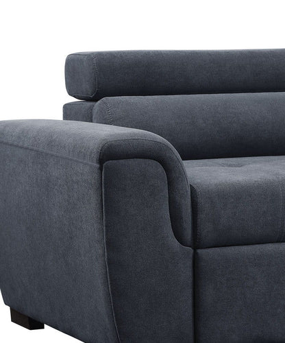Close-up of the Haris Fabric Sleeper Sofa Sectional in dark gray, featuring wide cushioned armrests, a plush backrest, adjustable headrest, and storage ottoman, shown against a white background.