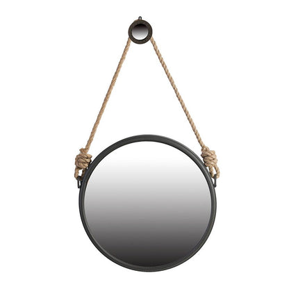 The Handsome Cleveland Mirror features a round metal frame in black and hangs from a thick knotted rope looped over a black hook, blending contemporary design with stylish wall decor.