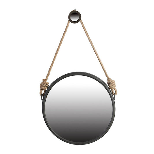 The Handsome Cleveland Mirror features a round metal frame in black and hangs from a thick knotted rope looped over a black hook, blending contemporary design with stylish wall decor.