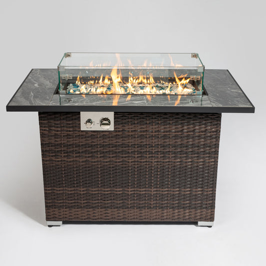 The 44" Outdoor Fire Pit Table, Propane Fire Table with Ceramic Tabletop in Espresso features a sleek base, black ceramic top, glass wind guard, decorative stones, and visible flames, shown against a plain white background.