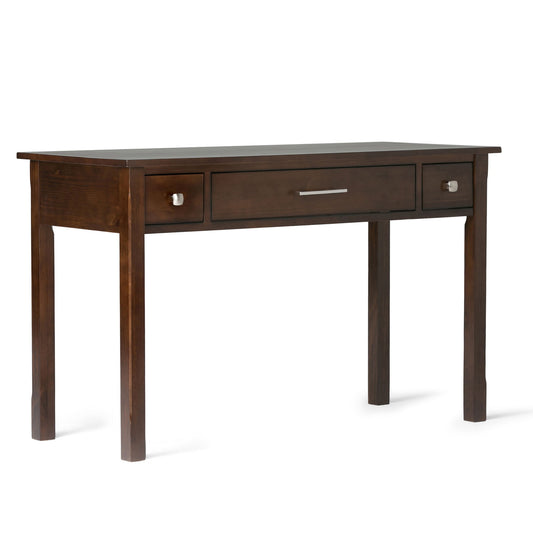 The Avalon Handcrafted Writing Office Desk features a dark brown wood finish, three drawers, a long silver handle on the center drawer, and small square knobs on the side drawers.