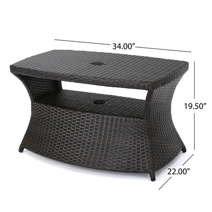 The Berkeley - Chaise Lounge Side Table is a rectangular dark brown wicker outdoor table with an open middle shelf, center umbrella hole, and measures 34"W x 22"D x 19.5"H.