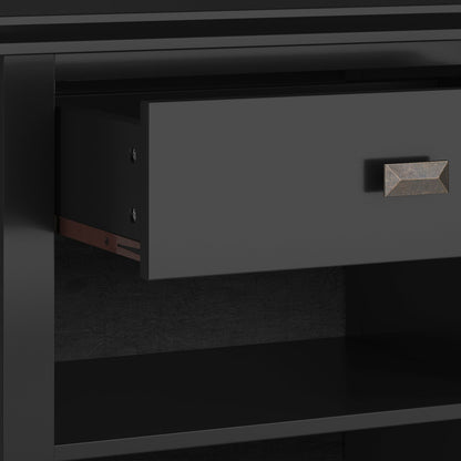 A close-up of the Artisan - Handcrafted Bedside Table shows a partially open, matte black drawer with a geometric metal handle, set in a matching black cabinet.