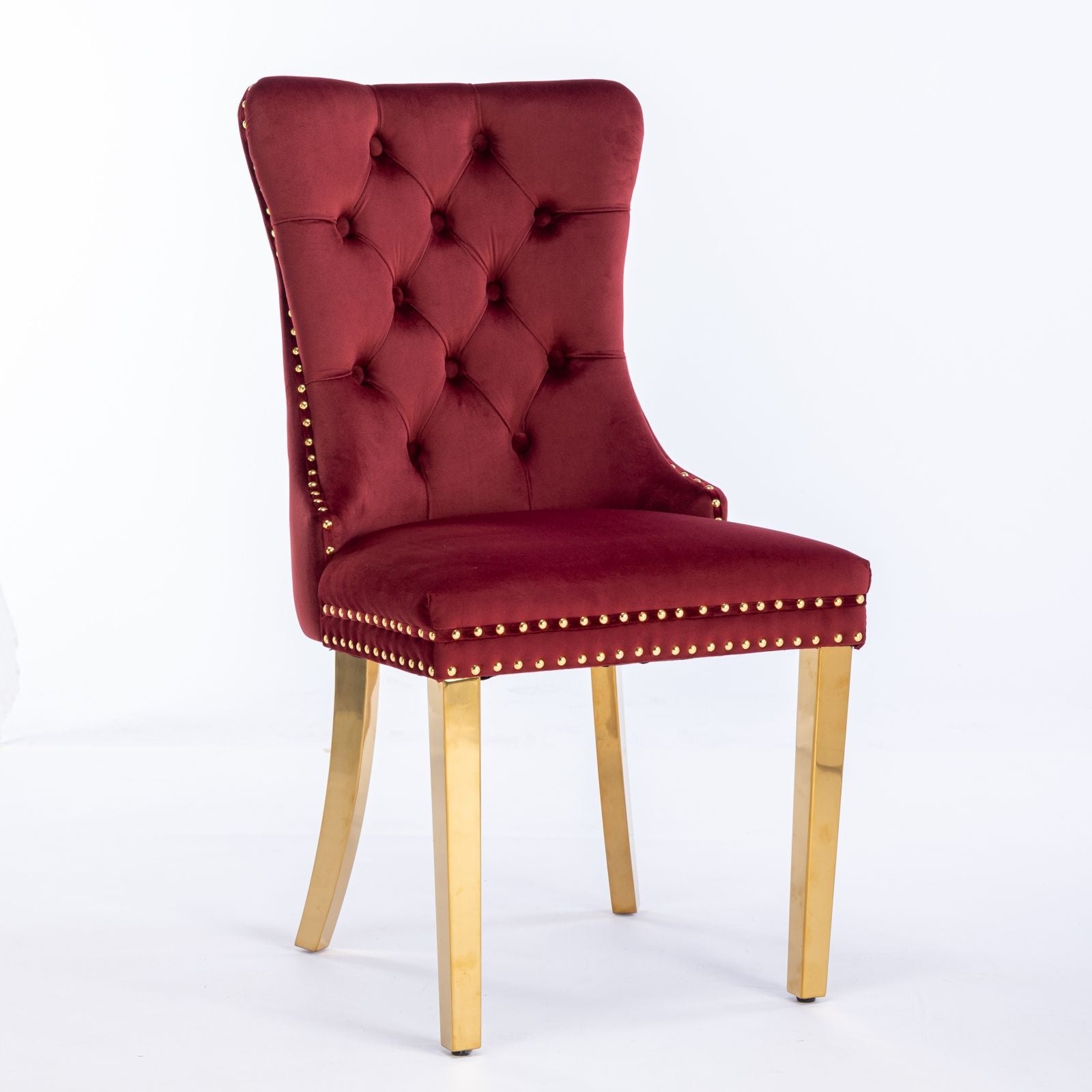 The Nikki set features two modern, high-end tufted solid wood dining chairs upholstered in velvet with gold stainless steel plated legs and nailhead trim, shown against a plain white background.