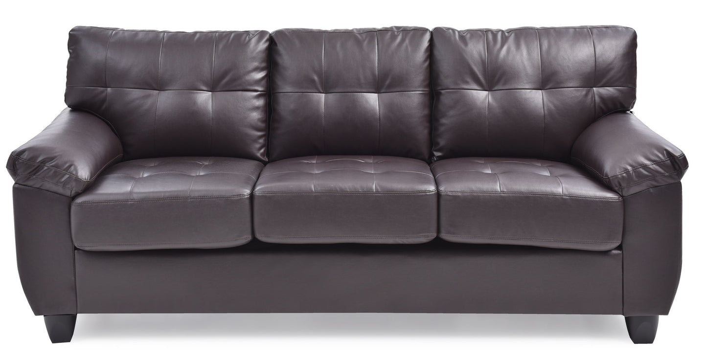 The Comfortable Sofa is a three-seater in dark brown leather with tufted back and seat cushions, wide armrests, and short black legs, displayed against a white background.