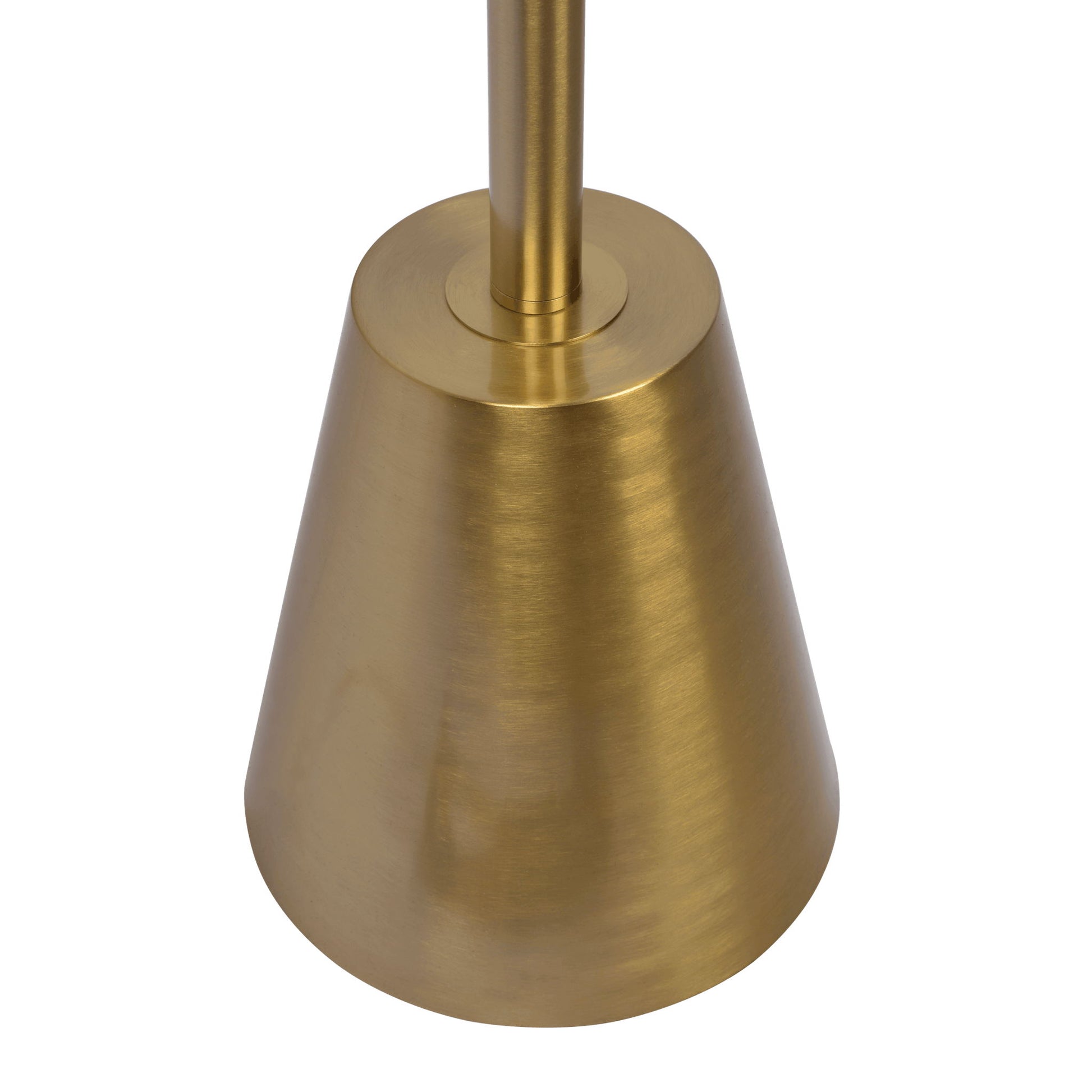 A close-up of the Lumina Floor Lamp’s gold cone base, showing its sleek shape and vertical pole, with a brushed brass finish.