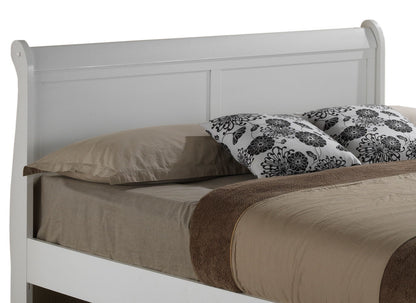 The Elegant Trundle Bed With Timeless Charm features a white wooden frame, a beige sheet, brown blanket and pillow, plus two decorative pillows with a black floral pattern.