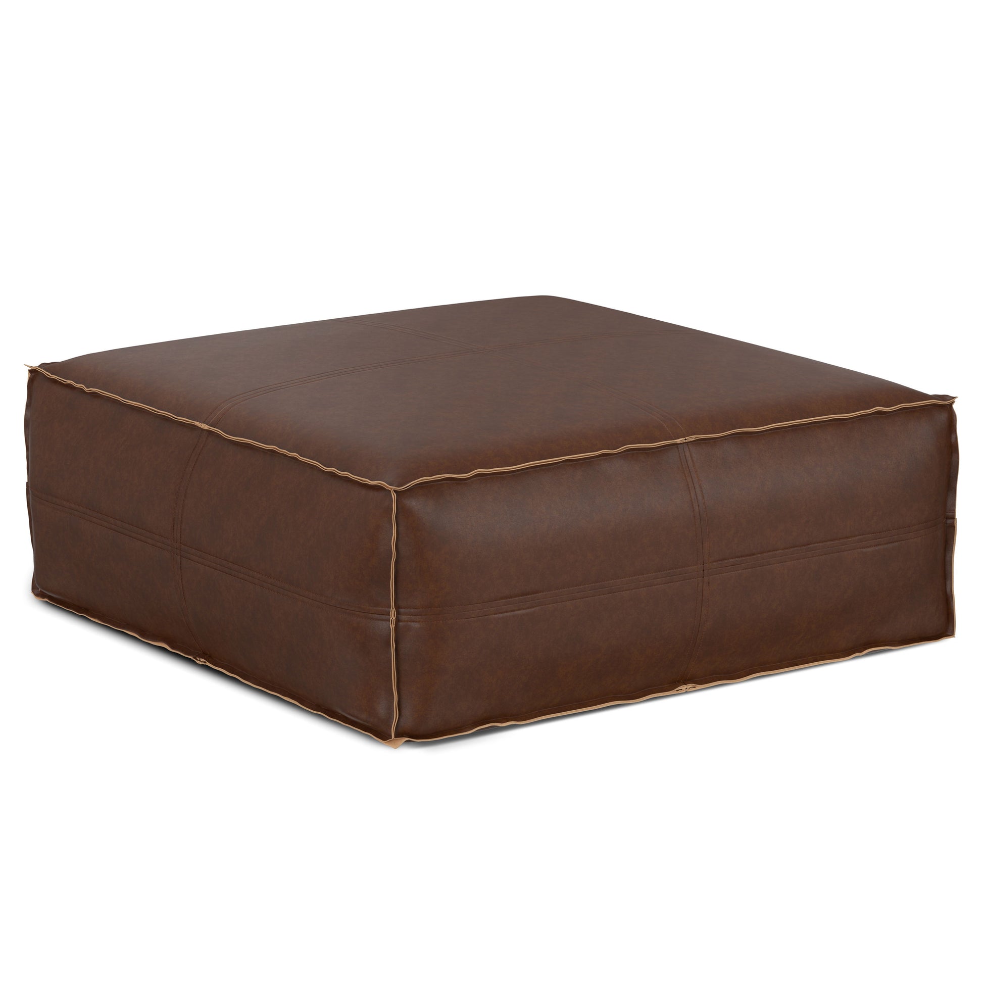 The Brody Large Square Coffee Table Pouf, featuring brown leather with visible stitching and a slightly distressed finish, sits on a white background.