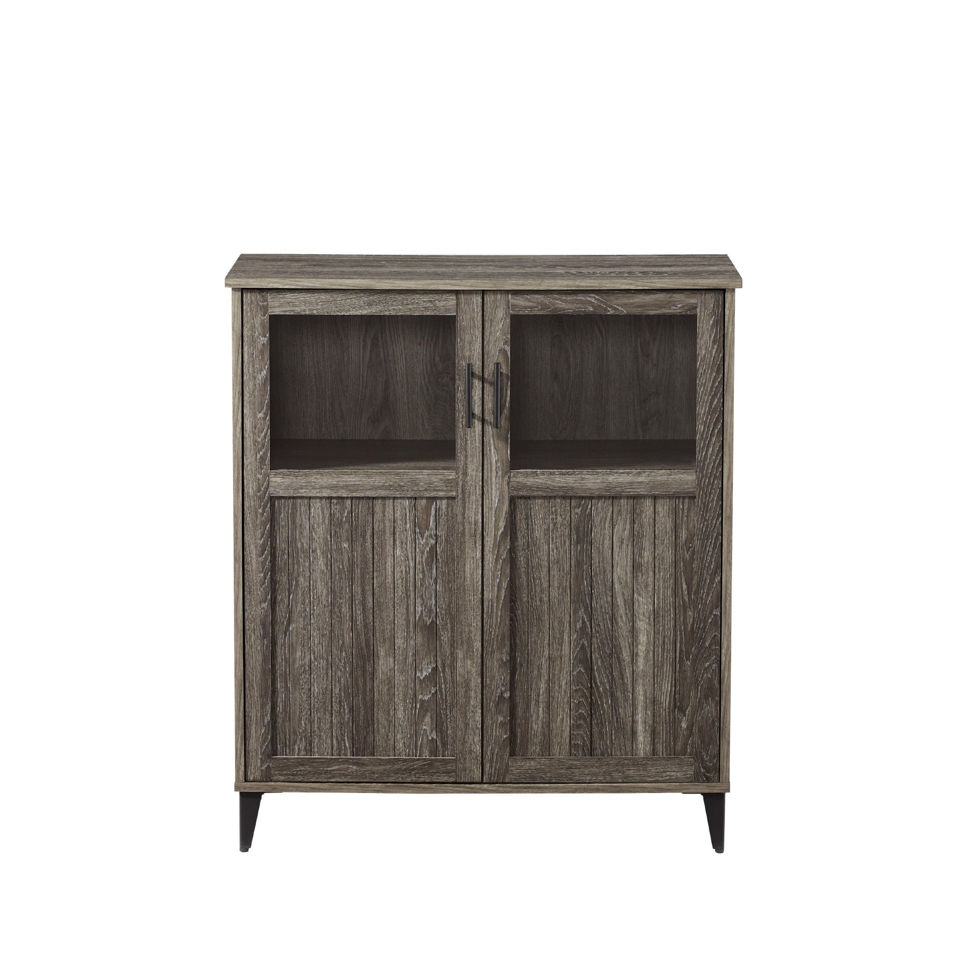 The Modern Grooved Door Accent Cabinet features two doors with rectangular glass panels on top, vertical wood paneling below, a weathered gray finish, metal handles, and short legs.
