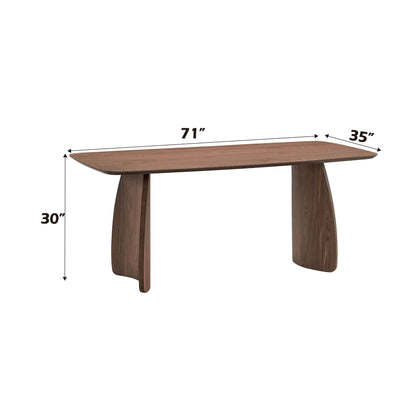 The Hadasa Dining Table in walnut features a rectangular wooden design with curved edges and two wide, curved legs. It measures 71"L x 35"W x 30"H and is set against a white background.