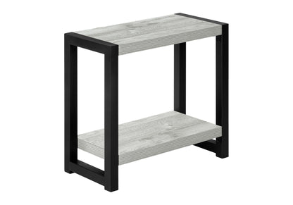 The Accent Side Table is a small, narrow, 2-tier piece with a black metal frame and two light gray wooden shelves. Its contemporary and modern design makes it a perfect minimalist accent for any space.
