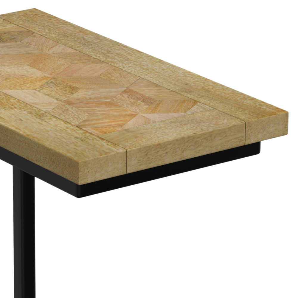 A close-up of the Skyler - Handcrafted C Side Table shows its light-toned, geometric patterned top and sturdy black metal frame and leg.