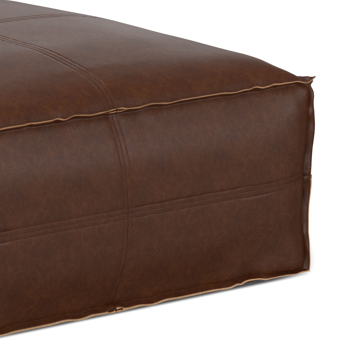 Close-up of the Brody Large Square Coffee Table Pouf in brown leather, showcasing its visible stitching, soft cushioned surface, and detailed leather upholstery texture.