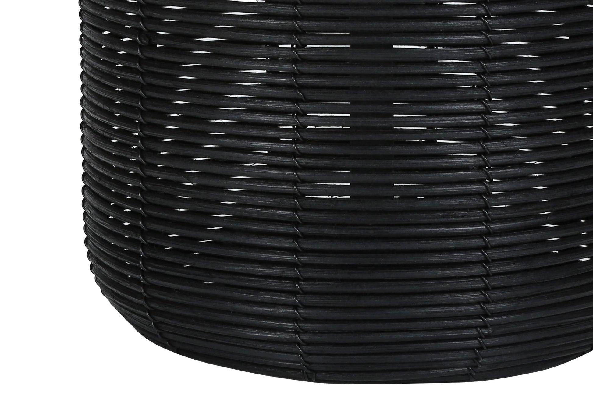 Close-up of a modern table lamp crafted from black rattan, highlighting the detailed interlaced texture and cylindrical shape with gently curved sides.