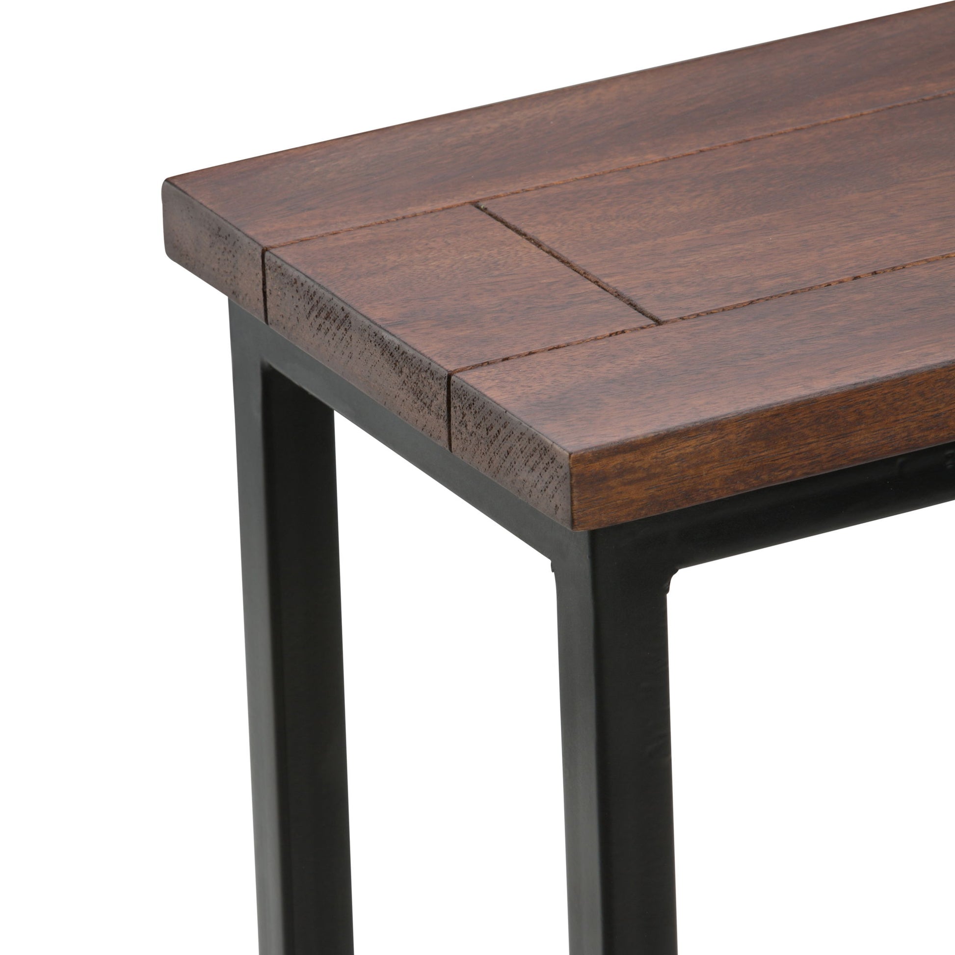 A close-up of the Skyler - Handcrafted C Side Table shows its dark brown wooden tabletop and black metal legs, highlighting the detailed corner and edge craftsmanship.